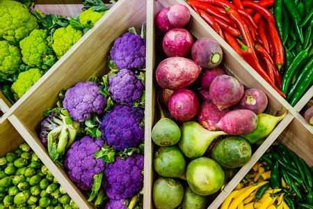 Top view Assortment of fresh vegetables at market counter, vegetable shop, farmer marketplace. Organic, healthy, vegetarian diet food concept. Selective focusの写真素材