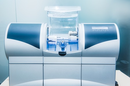 CAD CAM dental computer-aided machine in a highly modern dental laboratory for prosthesis and crowns...