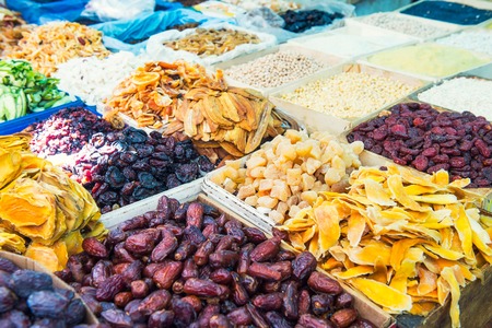 Close up assorted dried fruits and berries on market place in Tel Aviv, Israel. Selective focus, space for textの写真素材