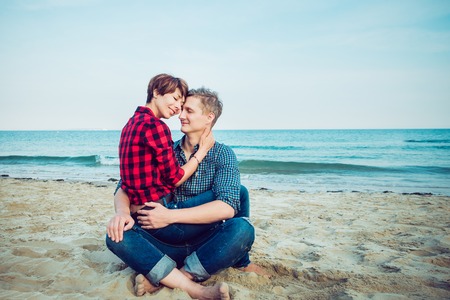 Portrait of happy couple on the beach.の写真素材
