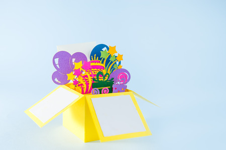 Happy birthday handcraft pop -up greeting card made of paper. Bright postcard with 3D paper figure...