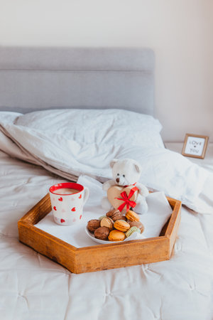 Teddy bear with heart shaped box on a white backgroundの写真素材