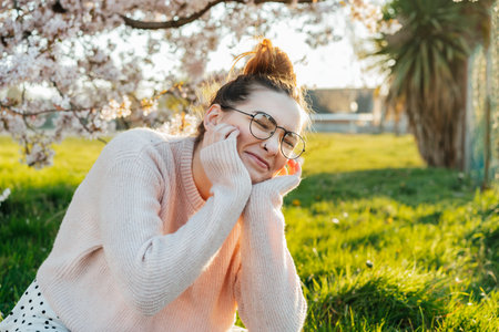 Portrait of young laughing caucasian hipster girl in glasses with pimples, acne on her face. Body...