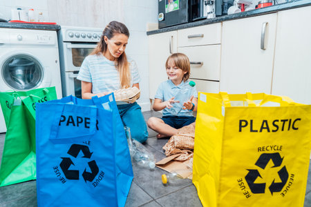 Mother is teaching kid how to recycle help the boy aware environmental importance - mom educates son...