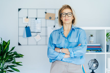 Portrait of smiling 50s stylish, confident mature businesswoman, middle aged company ceo director, experienced senior female professional, business coach team leader in modern office. Female leaderの写真素材