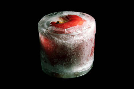 fresh frozen red apple isolated on blackの写真素材