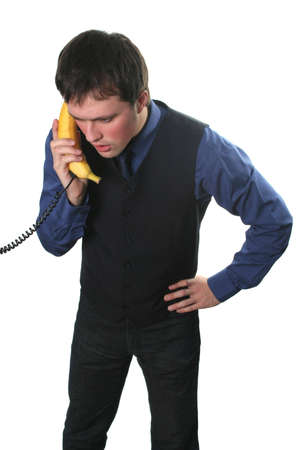 businessman have a business conversation via the banana phoneの写真素材