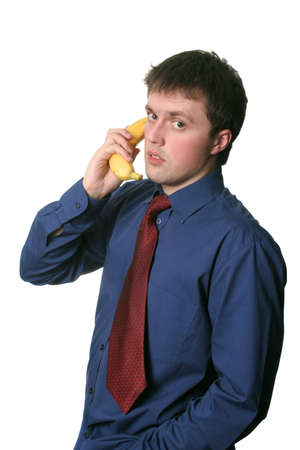 businessman have a business conversation via the banana phoneの写真素材