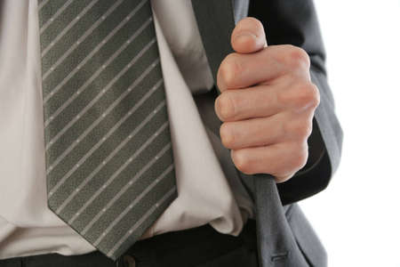 businessman holding the flap of his suit