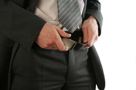 businessman holding the strap of his suitの写真素材