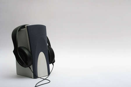 single speaker with a headphones hanging on itの写真素材