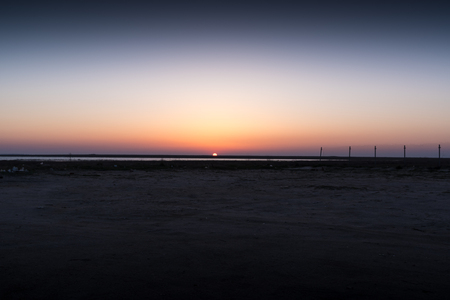 Seascape. Red moon against the dark skyの写真素材