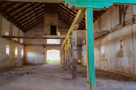 Wooden old structures in an abandoned stable in the Natalyevka estate, Kharkiv region, Ukraineの写真素材