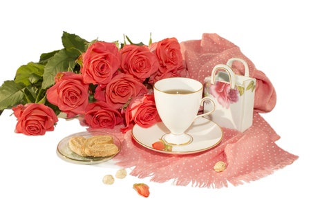 The white cup, orange roses, a pink scarf are isolated on a white background  の写真素材