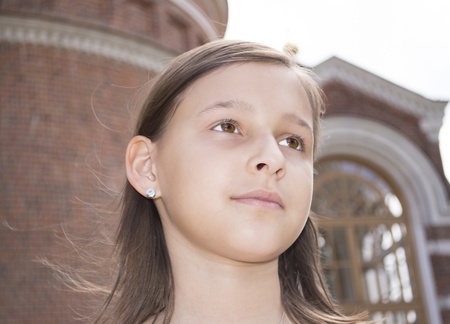 Portrait of the girl against a cathedral の写真素材