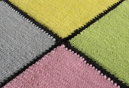 The fragment of a knitted plaid is photographed by a close up の写真素材