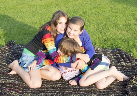 Girls have a rest on a grass の写真素材