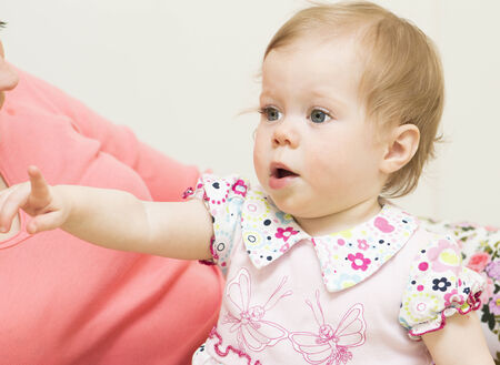Baby of 11 months old is pointing a finger の写真素材