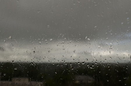 rain drops on the window in summerの写真素材