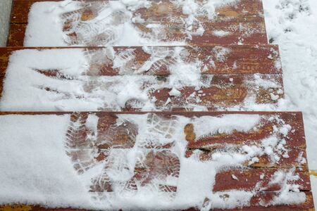Winter Footprints. Footprints on snow covered stepsの写真素材