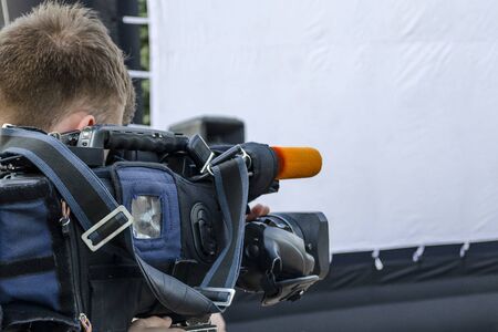 Cameraman makes movie news white background