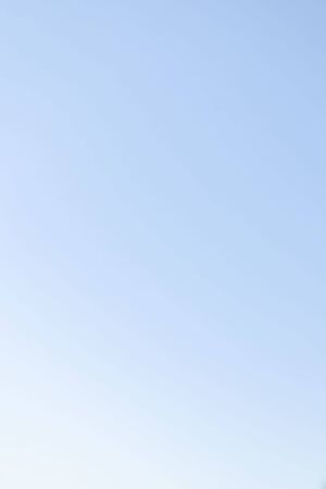 Natural gradient background of clear blue sky.の写真素材