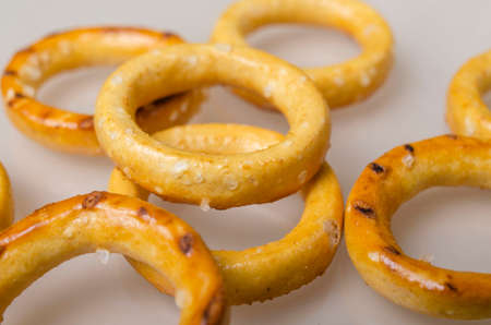 Drying bagels with salt close-up on a beige background
