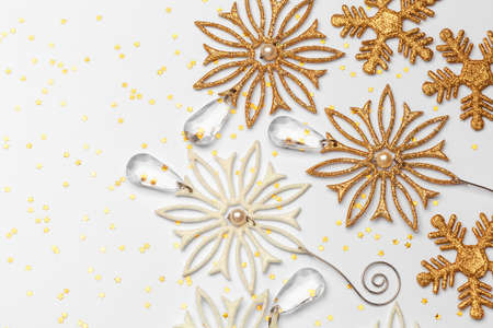 Festive christmas decoration of gold snowflakes with glitter stars. Holiday concept.の写真素材