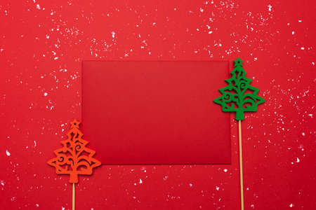 Festive background with Christmas tree toy, red envelope. Festive background with copyspace.の写真素材