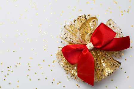 Celebratory white background with Christmas festive bow. Christmas background with copyspace.