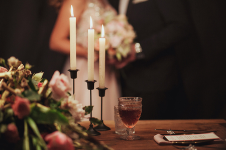 Table set for an event party or wedding reception. loving couple on the background.の写真素材