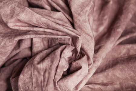 Coffee color checked fabric as a background. Bokeh, fashion, clothes, textured background, sewing industry, cozy and home conceptの写真素材