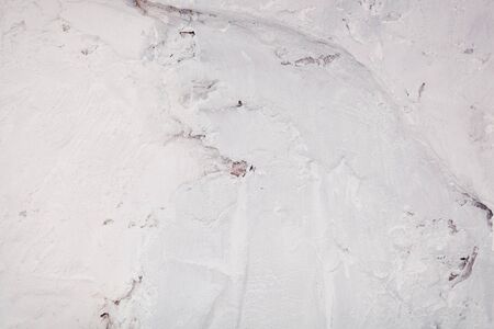 abstract background of a concrete wall. White old plaster.