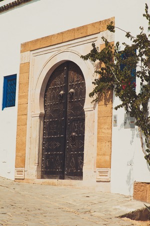old metal gate with metal rivets to temple or mosque
