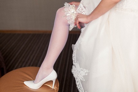 beginning of the wedding day. the bride wears a wedding garterの写真素材