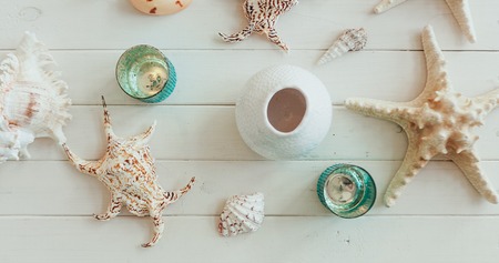 Beach accessories. starfish and sea shell on wooden background. Top view with copy spaceの写真素材