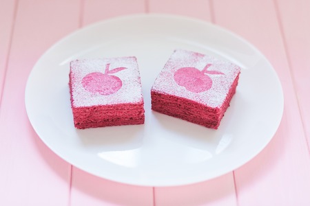 Homemade currant pastila on white plate with pink wooden background. Berry marshmallow pasteの写真素材