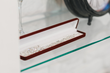 Jewelry in the window case at jewelers shop. Concept of wealth and luxurious lifeの写真素材