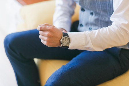 Watch on mans hand. Groom preparing for wedding ceremony. Close-up shotの写真素材