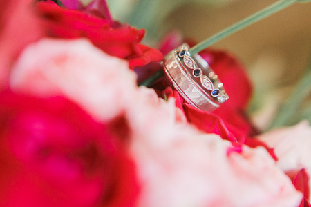 wedding rings on flowers bouquet. Close-up viewの写真素材