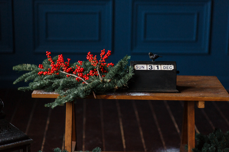 Christmas still life concept, retro calendar, pine branches, red berries. Soft and natural colors, good for xmas card and banners.の写真素材