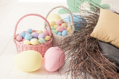 Easter eggs in the nest on rustic wooden backgroundの写真素材