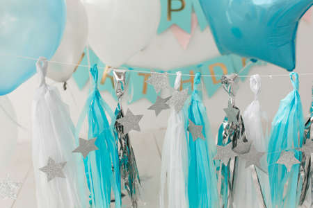 Blue and white foil garland decor for birthday partyの写真素材