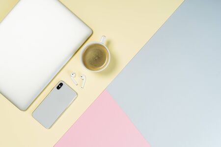 Laptop Phone Coffee Cup Pastel Background Top Viewの写真素材