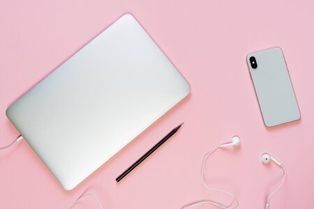 Laptop Phone Earphone Pencil Pink Workplace Topの写真素材