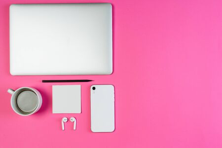 Laptop Phone Coffee on Pink Workspace Flat Layの写真素材