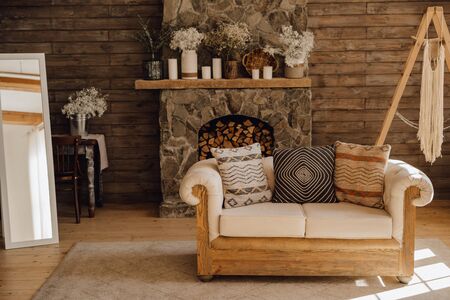 Chalet Cozy Interior Wooden Sofa and Fireplaceの写真素材
