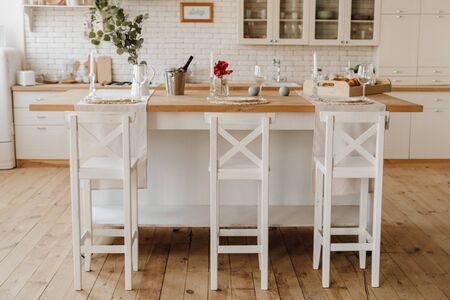 White Cozy Kitchen Island Table at Home Interiorの写真素材