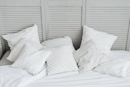 White Blank Pillow on Home Bedroom Headboardの写真素材