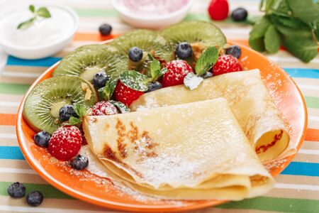 Thin Crepes Dessert with Strawberry Kiwi Close-upの写真素材